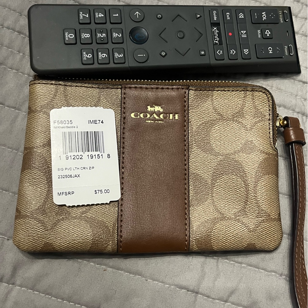 Coach brown signature wristlet. NWT